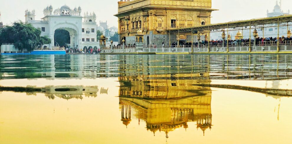 yellow temple near body of water