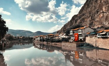 buildings beside calm body of water